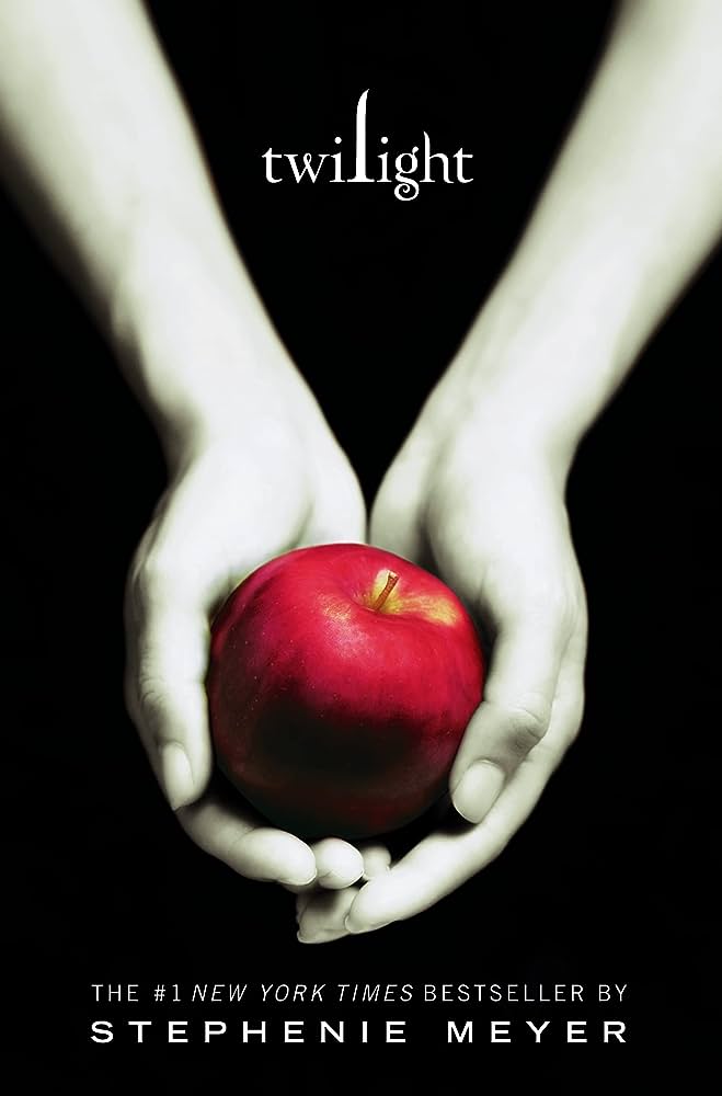 The Twilight book cover: two white hands holding an apple.