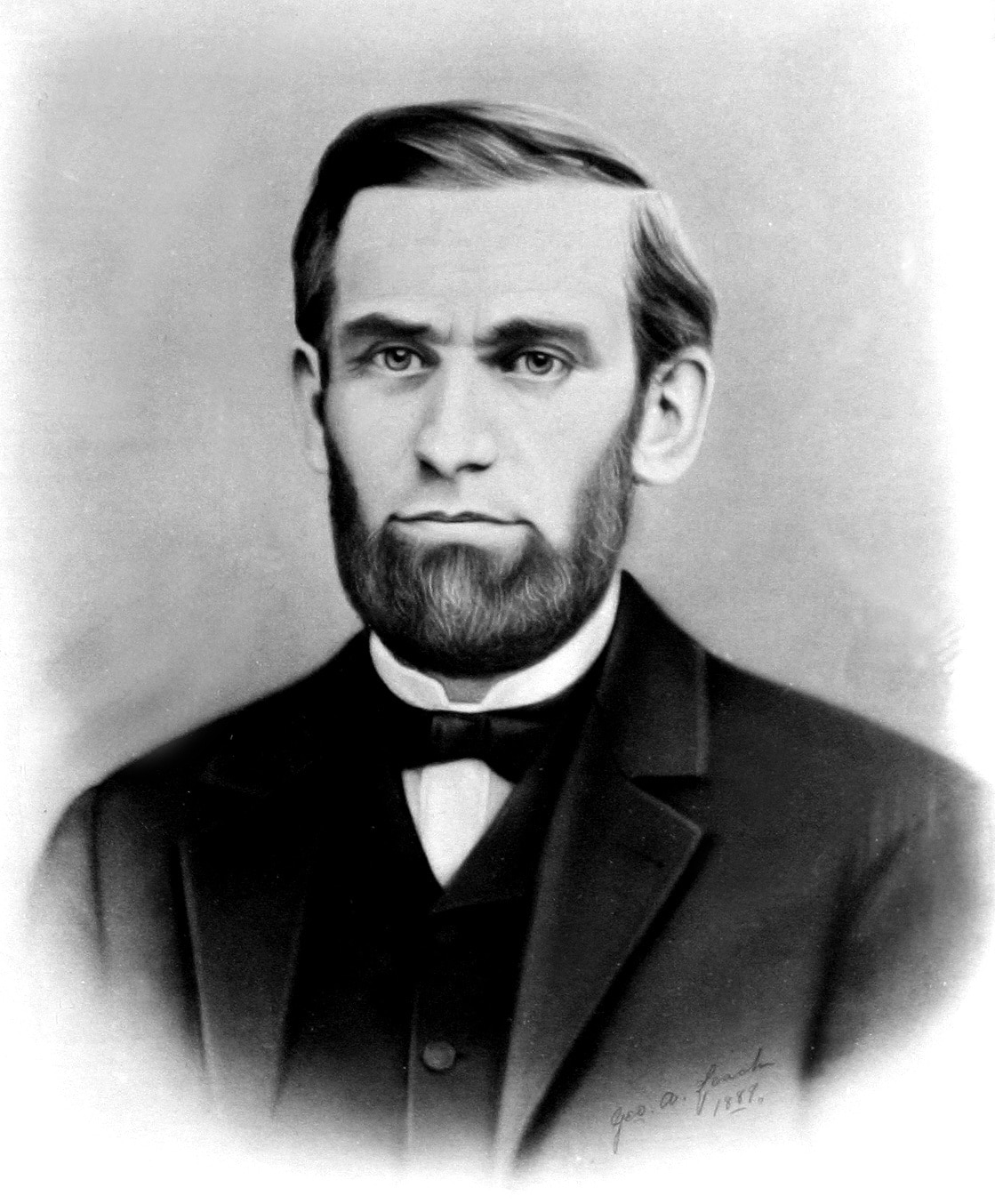 Old photo of frowning man with beard