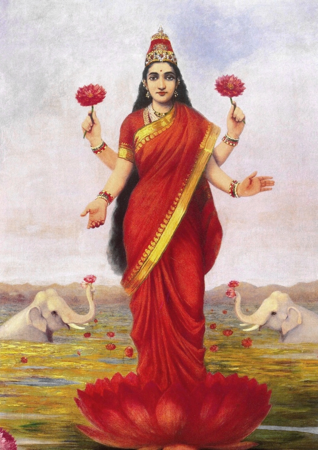 Goddess Lakshmi in red sari standing on a lotus with 4 arms