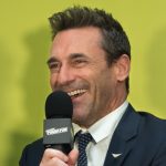 Jon Hamm with Microphone smiling
